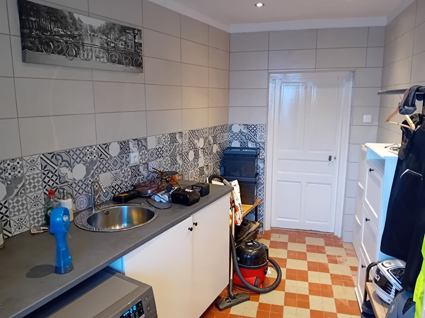 Kitchen in property located in Creuse, Nouvelle-Aquitaine, featuring modern tiles and essential appliances.