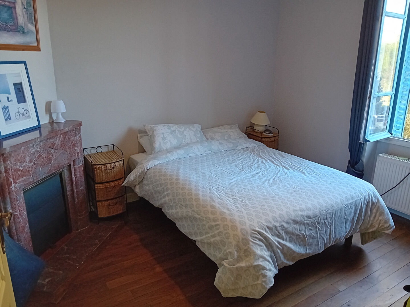 3-bedroom property in Creuse, Nouvelle-Aquitaine, featuring a comfortable bedroom with a fireplace and natural light.