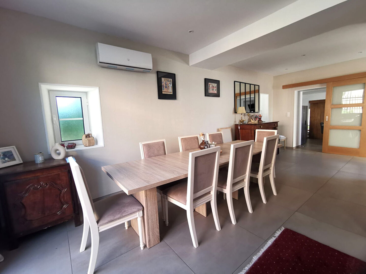 Spacious dining area with seating for eight in a property located in Corrèze, Nouvelle-Aquitaine.