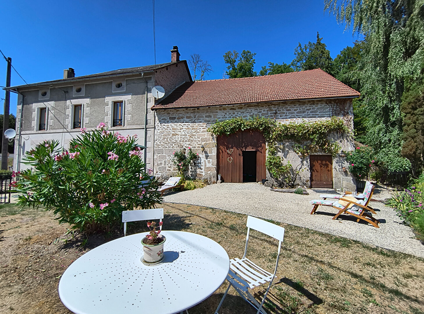 Charming property in Haute-Vienne, Nouvelle-Aquitaine, featuring a landscaped garden and traditional stone architecture.