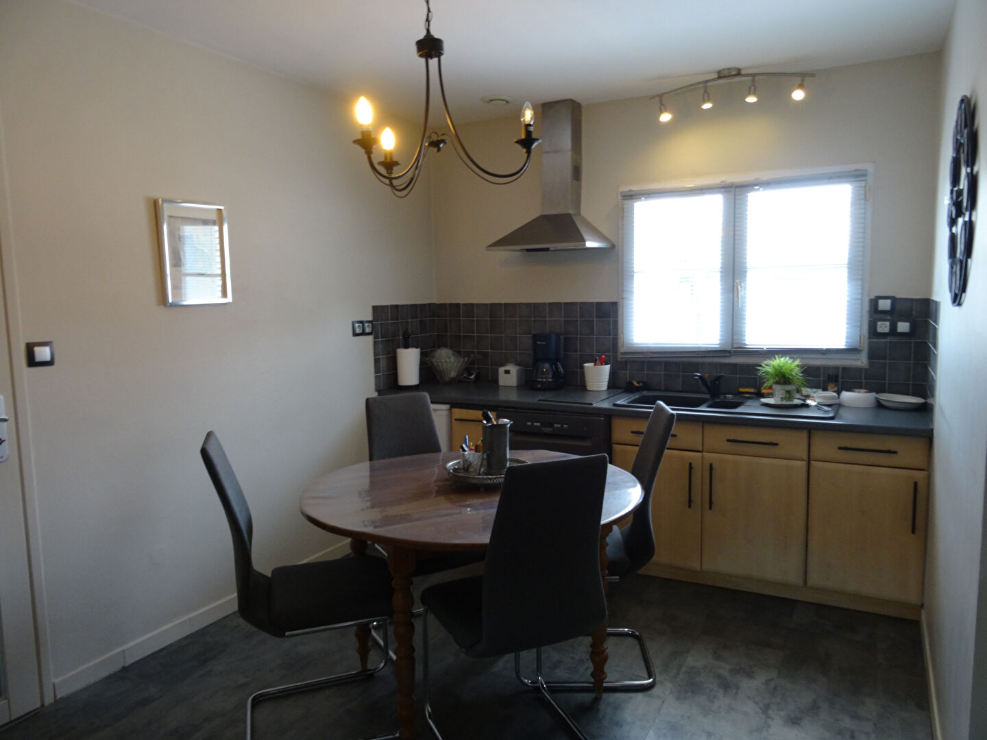 Modern kitchen with dining area in a property located in Vendée, Pays-de-la-Loire, featuring five bedrooms.