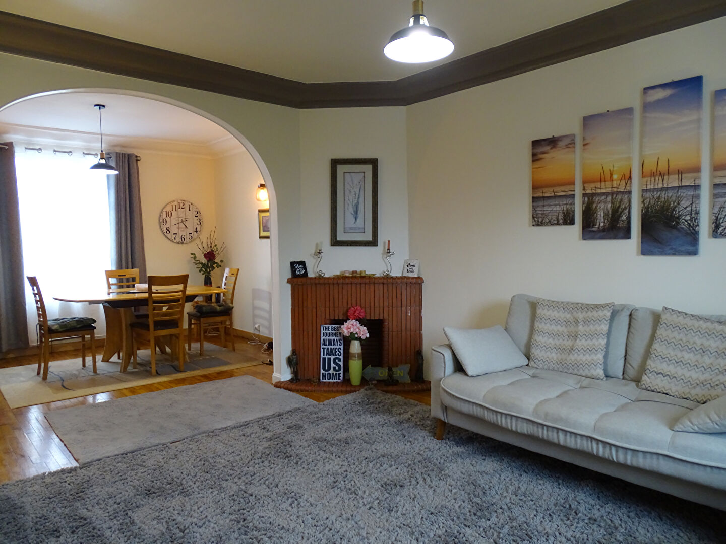Spacious living area featuring comfortable seating, leading to a dining space in Finistère, Brittany, with three bedrooms.
