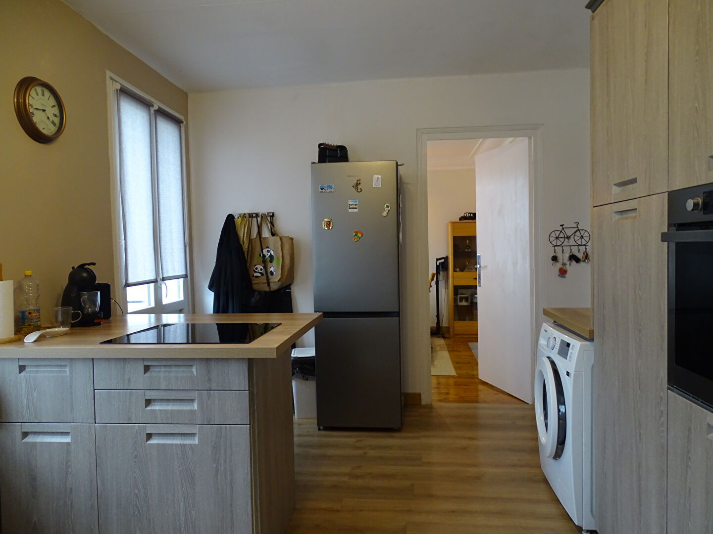 Modern kitchen with appliances and natural light in a property located in Finistère, Brittany, 29270.
