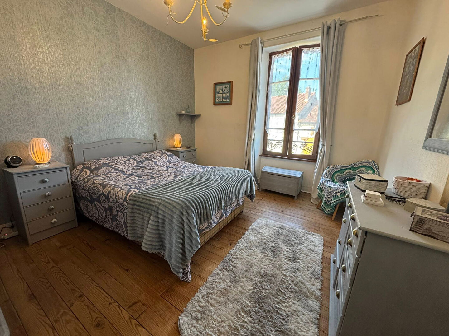 Spacious bedroom in a property located in Haute-Vienne, Nouvelle-Aquitaine, featuring wooden floors and natural light.