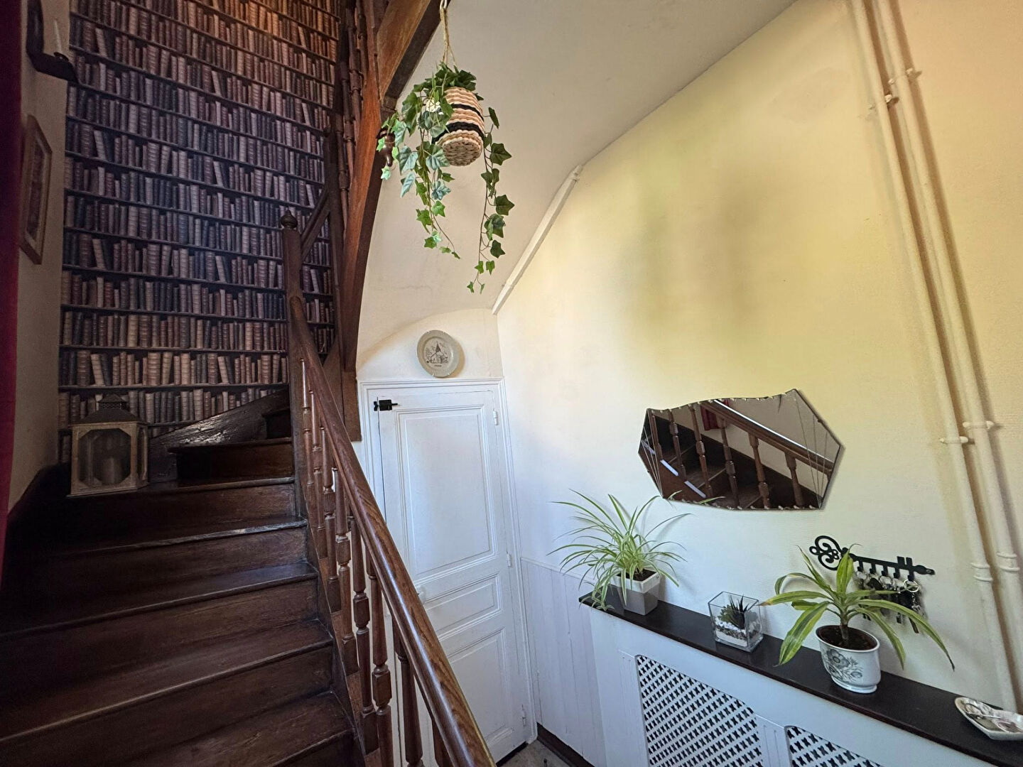 Entrance hall featuring wooden staircase and decorative wallpaper in Haute-Vienne, Nouvelle-Aquitaine, 87320 property.
