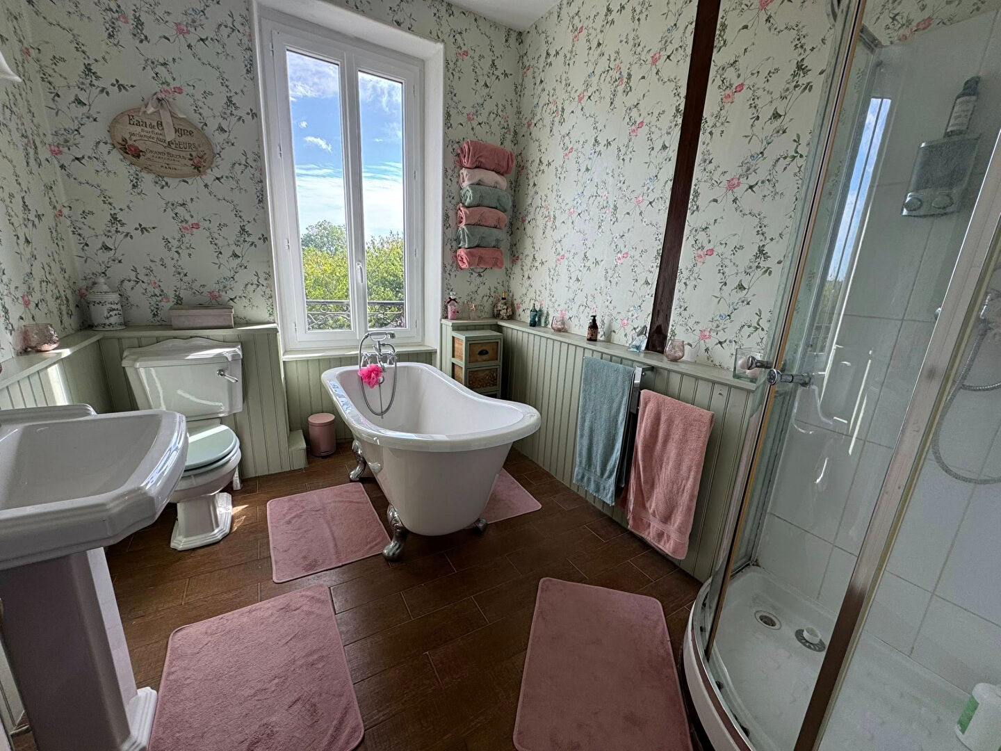 Charming bathroom featuring a freestanding bathtub and shower, located in Haute-Vienne, Nouvelle-Aquitaine.