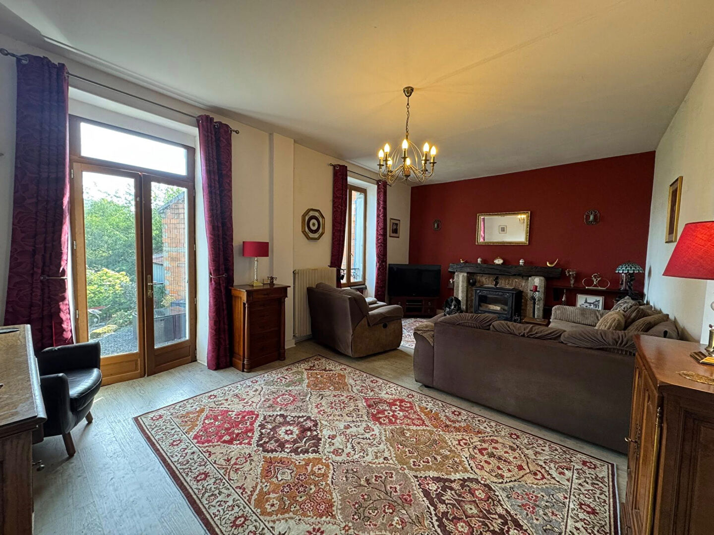 Spacious property in Haute-Vienne, featuring a cosy lounge with elegant decor and large windows for natural light.