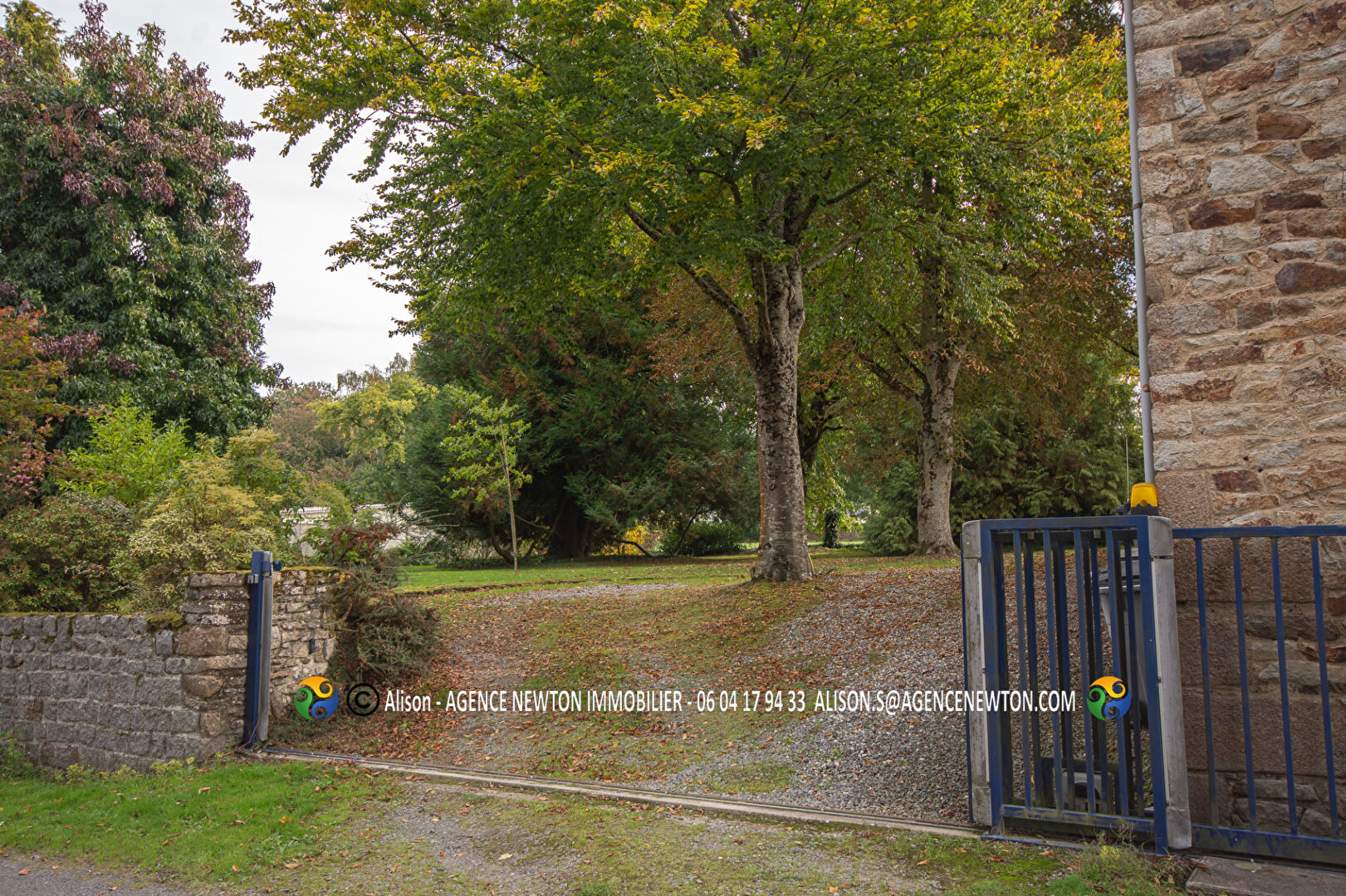 Four-bedroom property with a swimming pool in Manche, Normandy, surrounded by landscaped gardens.