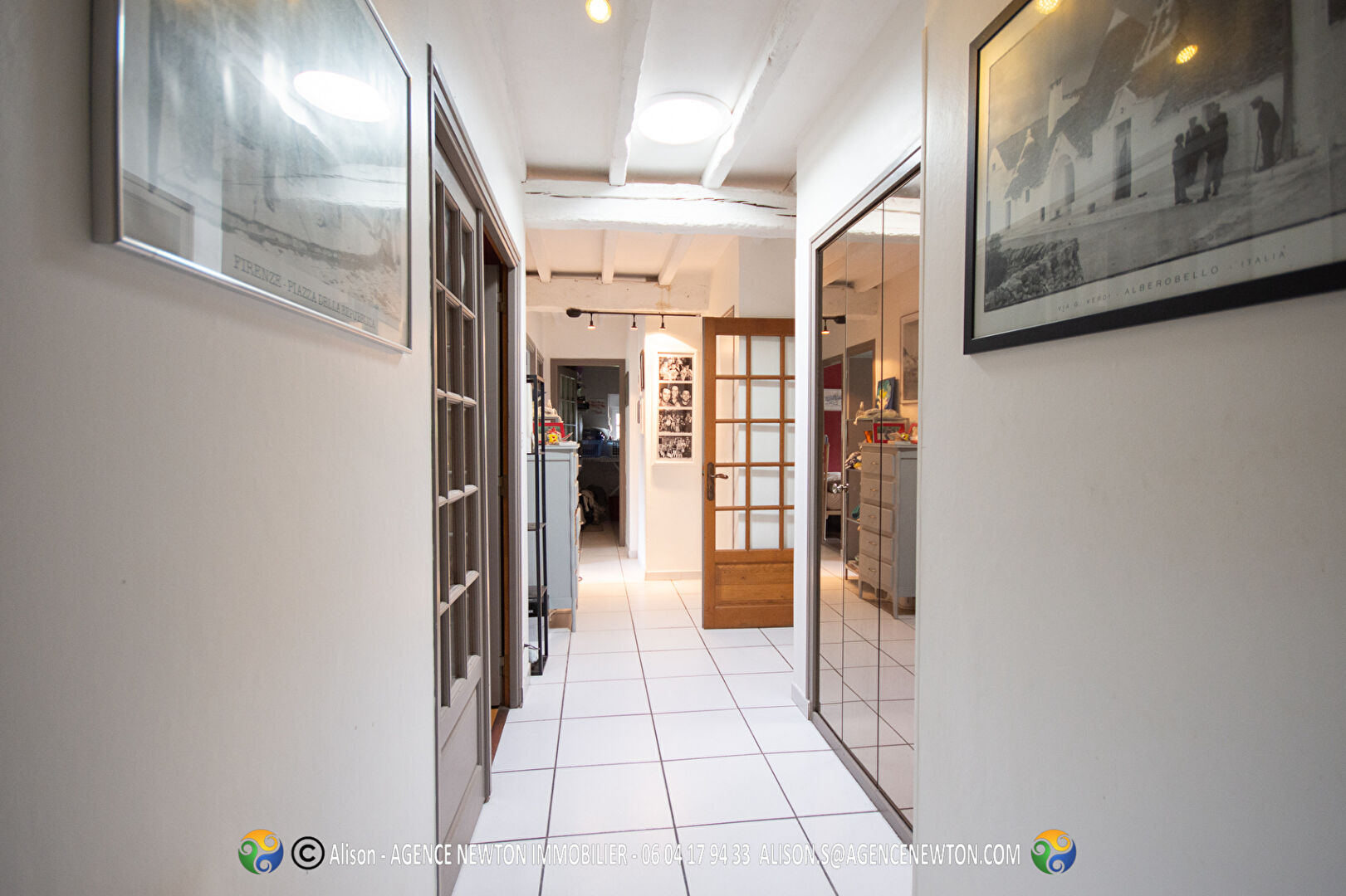 Four-bedroom property in Manche, Normandy featuring a swimming pool and spacious hallway with natural light.