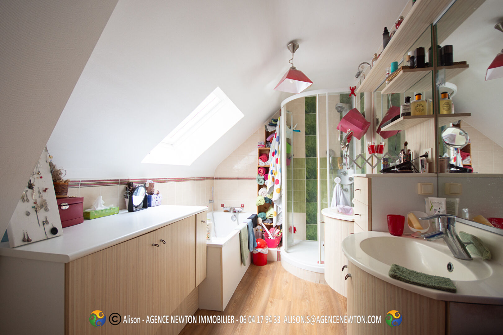 Four-bedroom property in Manche, Normandy, featuring a modern bathroom with shower and ample storage space.