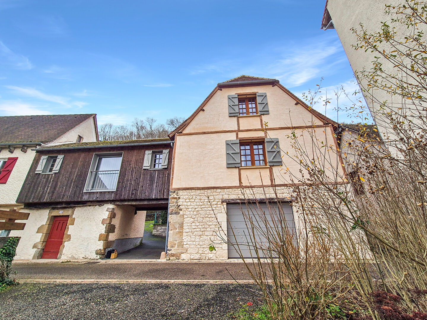Charming property in Corrèze, Nouvelle-Aquitaine, featuring a unique architectural style and spacious garage.