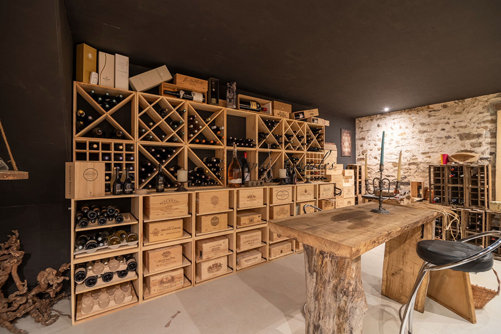 Wine cellar featuring wooden racks and storage in a property located in Haute-Vienne, Nouvelle-Aquitaine.