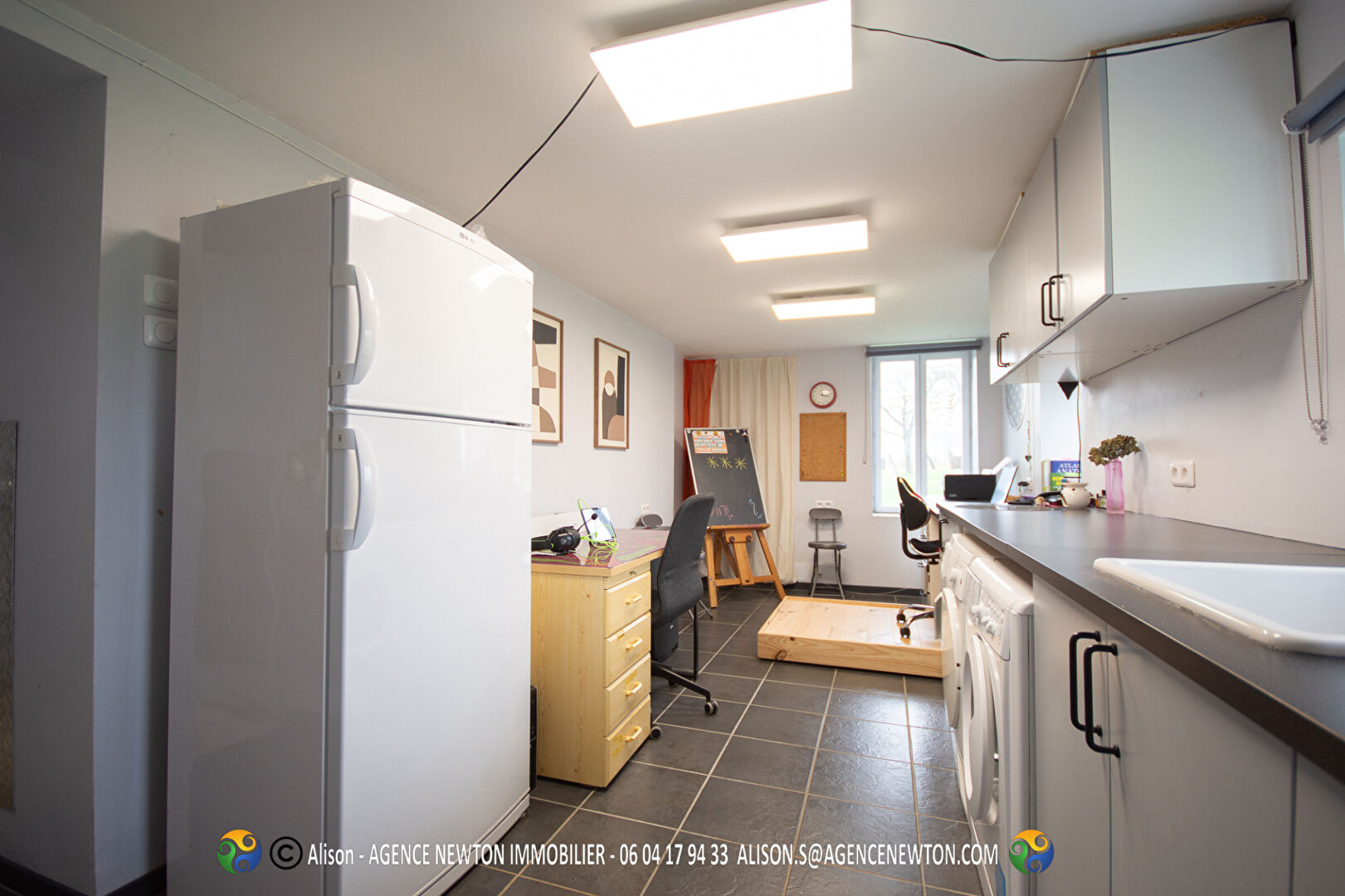 Bright kitchen in a 2-bedroom property located in Ille-et-Vilaine, Brittany, featuring modern appliances and workspace.