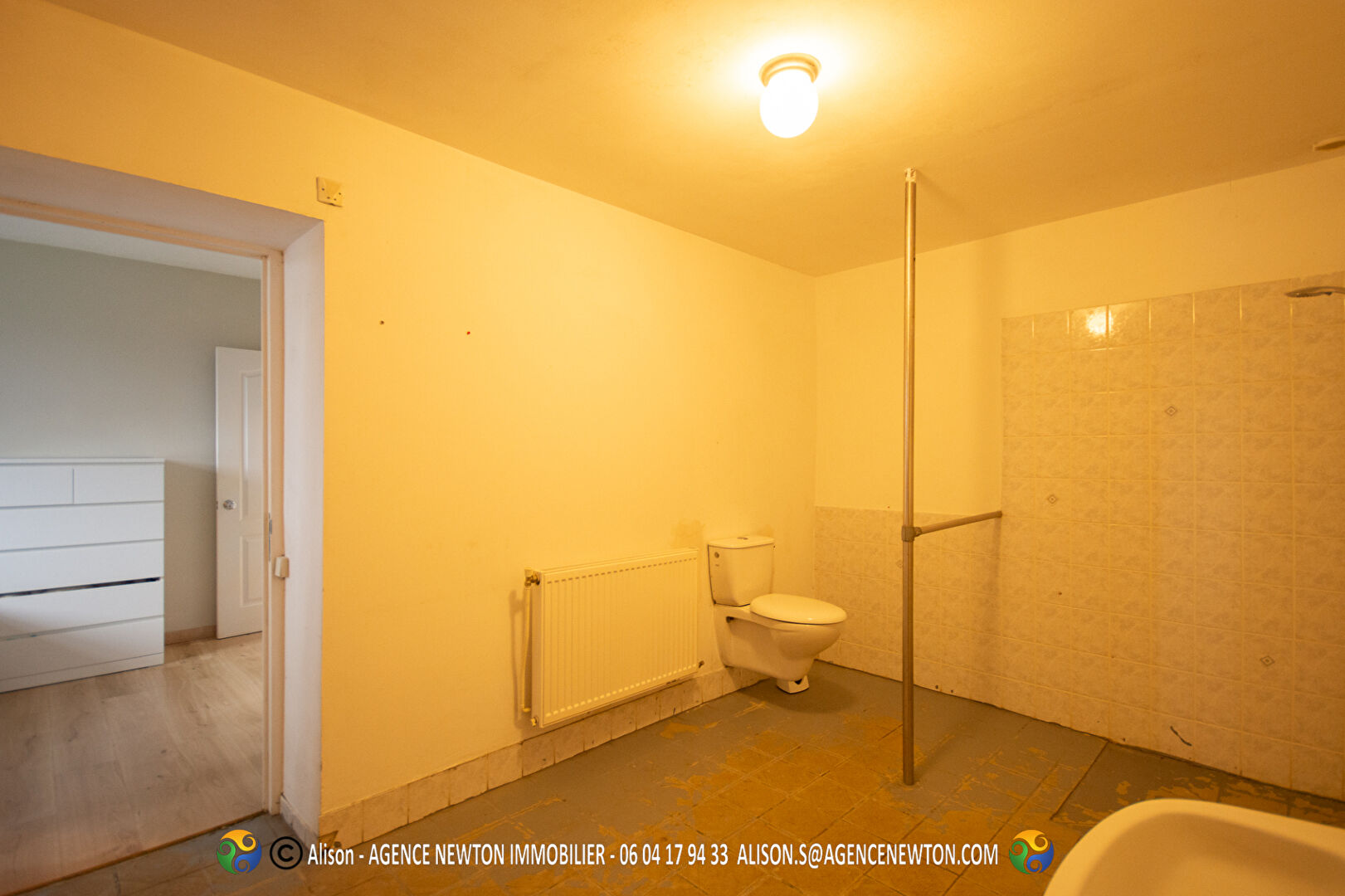 Two-bedroom property in Ille-et-Vilaine featuring a spacious bathroom with shower, toilet, and natural light.