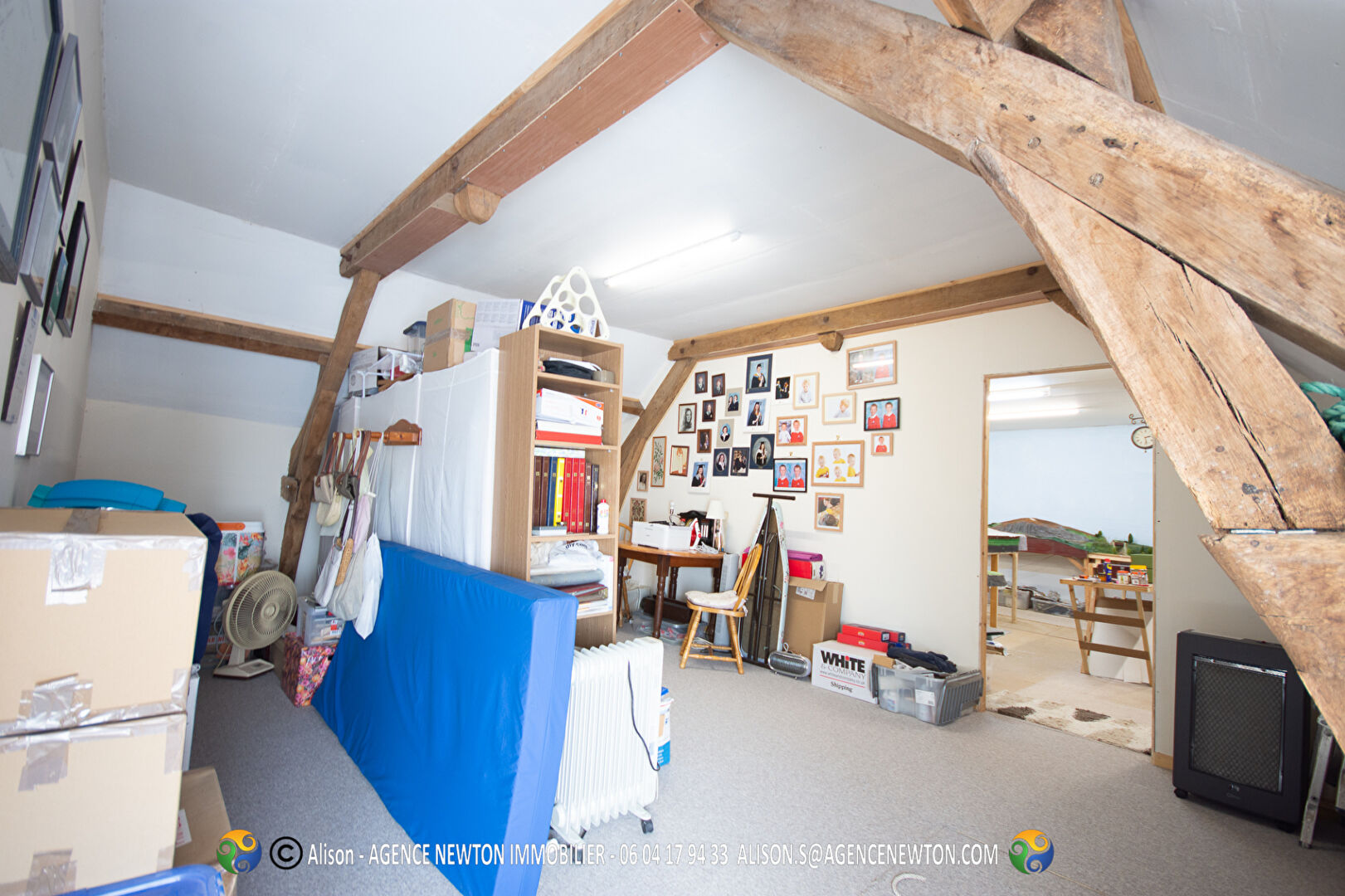 Spacious interior of a property in Mayenne, featuring wooden beams and rooms ready for personalisation.