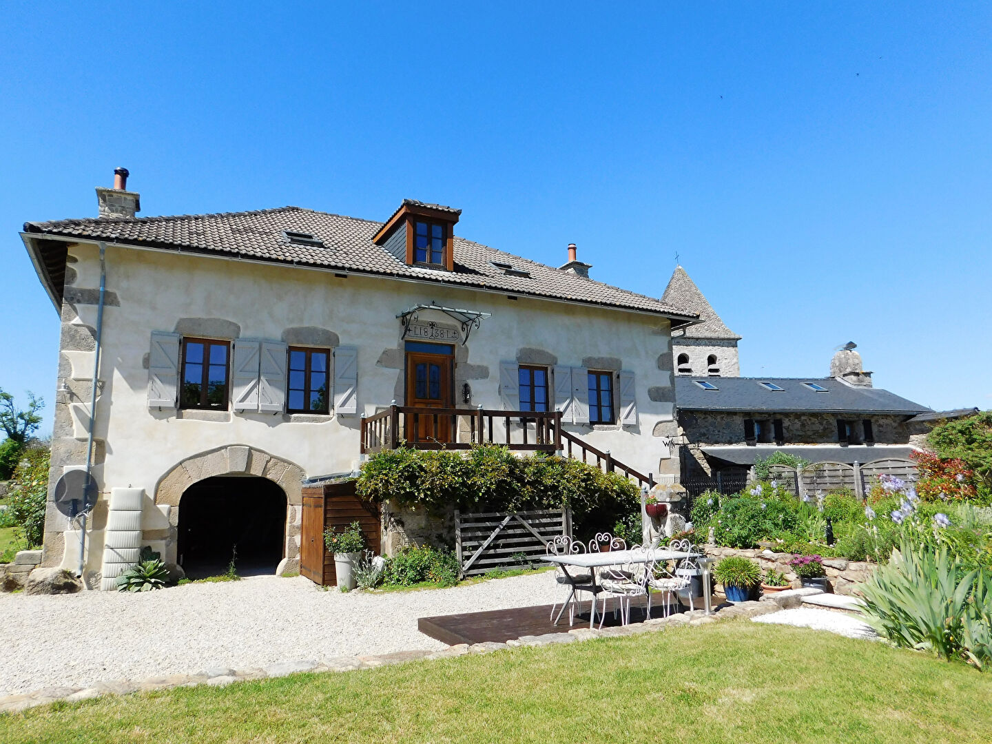 Spacious property in Corrèze, Nouvelle-Aquitaine, featuring a garden, terrace, and traditional architecture.