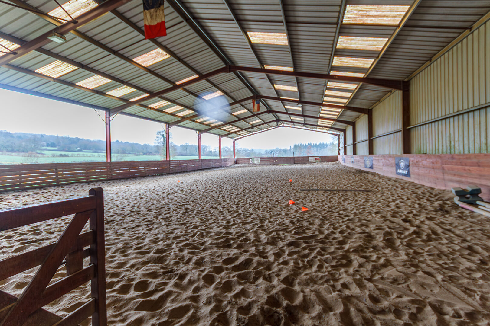 Equestrian property with indoor arena in Ille-et-Vilaine, Brittany, featuring sand surface and ample space for riding.