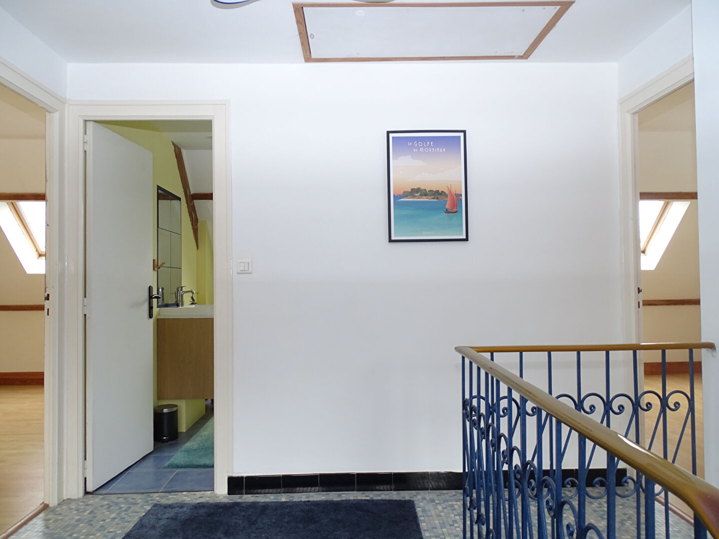 Bright interior hallway leading to a bathroom in a property located in Morbihan, Brittany, with four bedrooms.