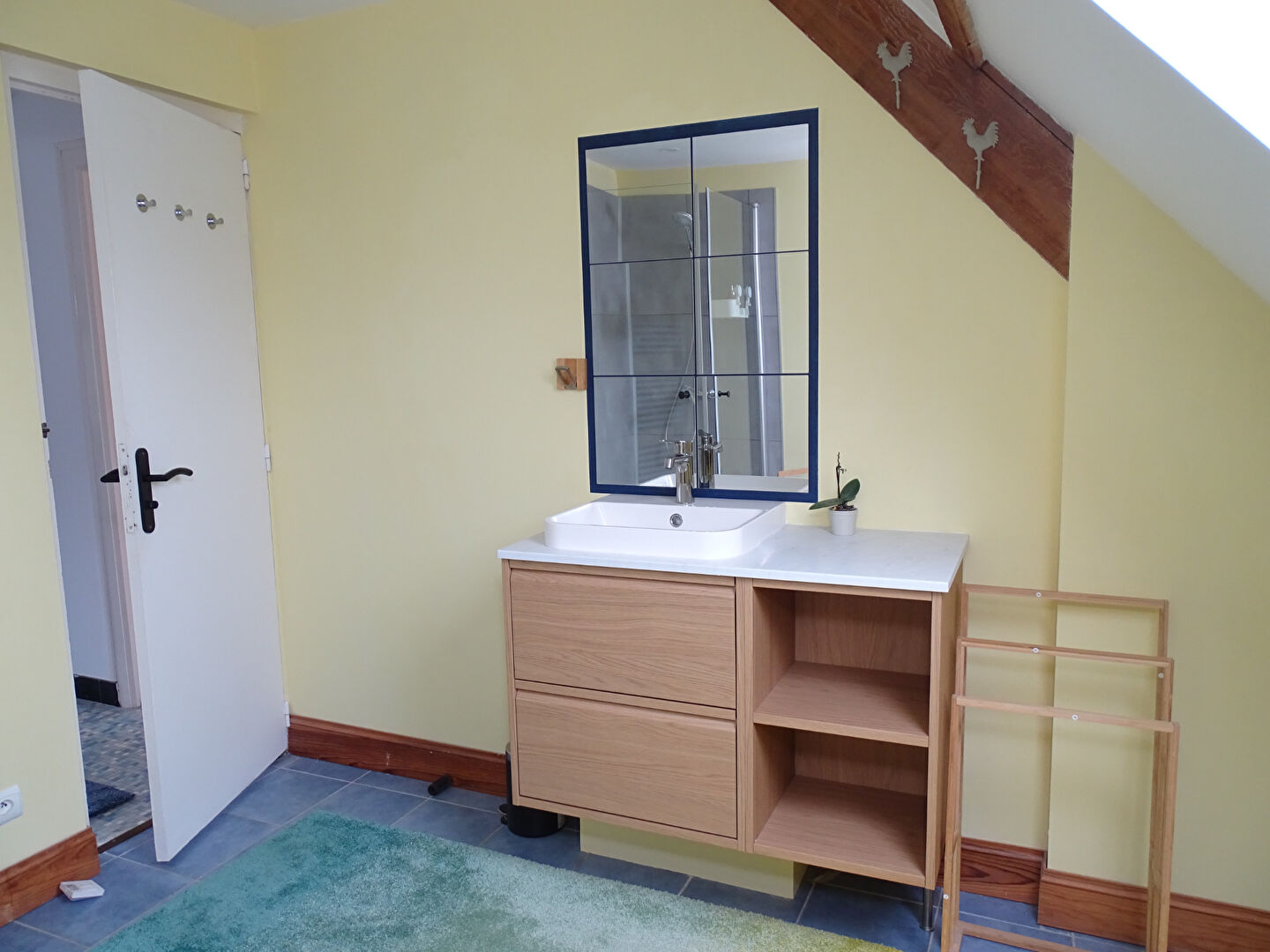 Modern bathroom featuring a sink unit and mirror in a property located in Morbihan, Brittany, postcode 56630.