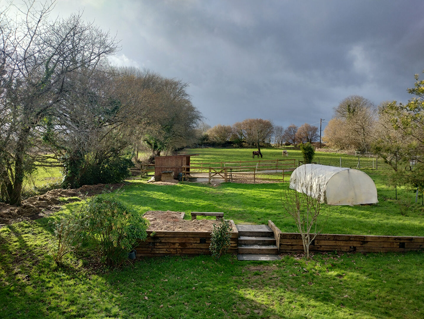 Spacious property in Morbihan, Brittany, featuring a garden, paddock, and outdoor space with a greenhouse.