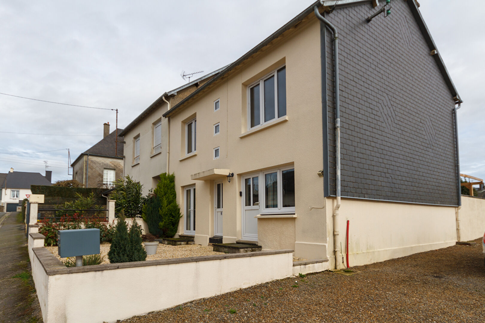 Three-bedroom property in Manche, Normandy, featuring a modern façade and landscaped garden area.