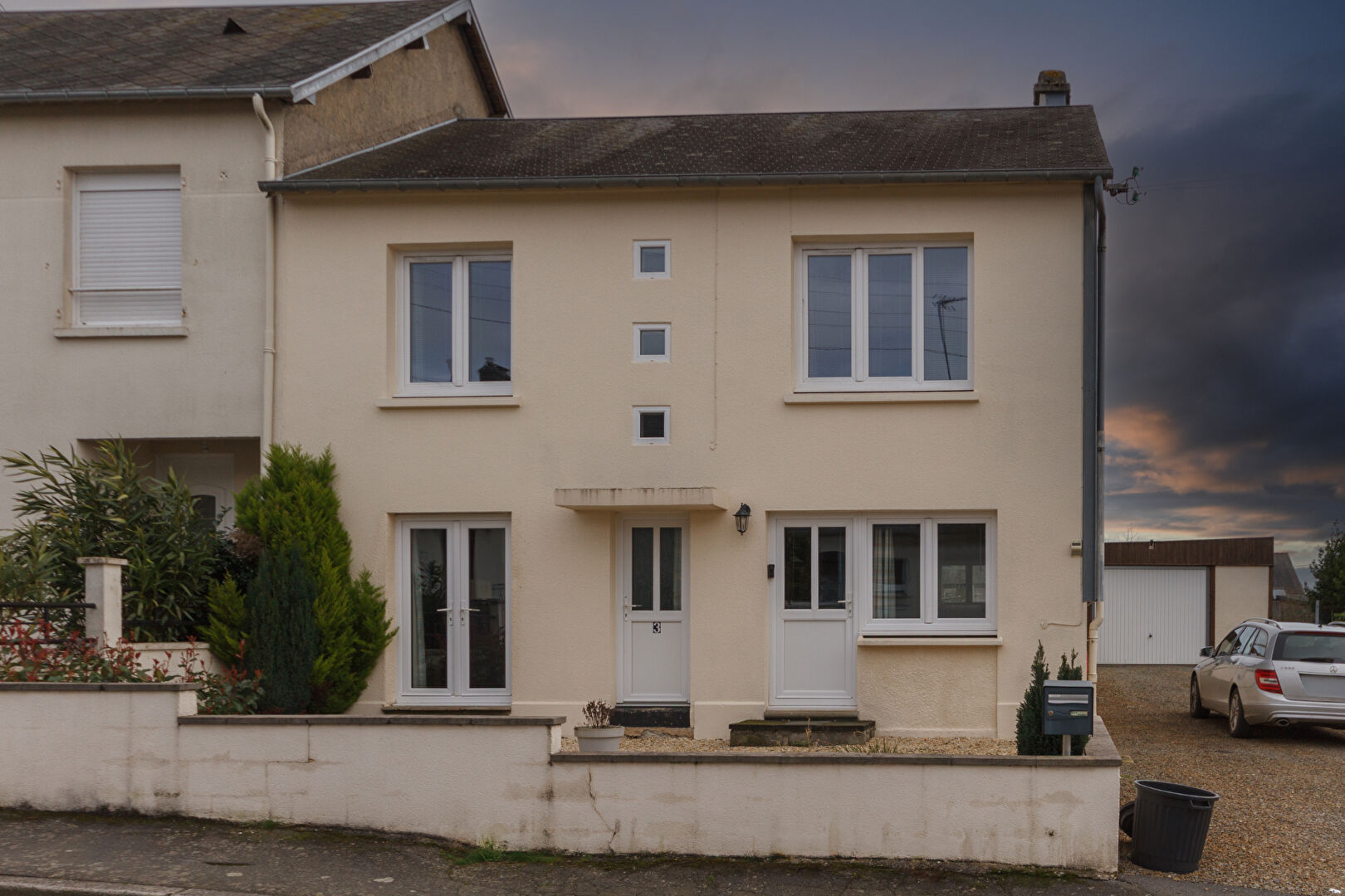 Three-bedroom property in Manche, Normandy, featuring a modern facade and garden space.