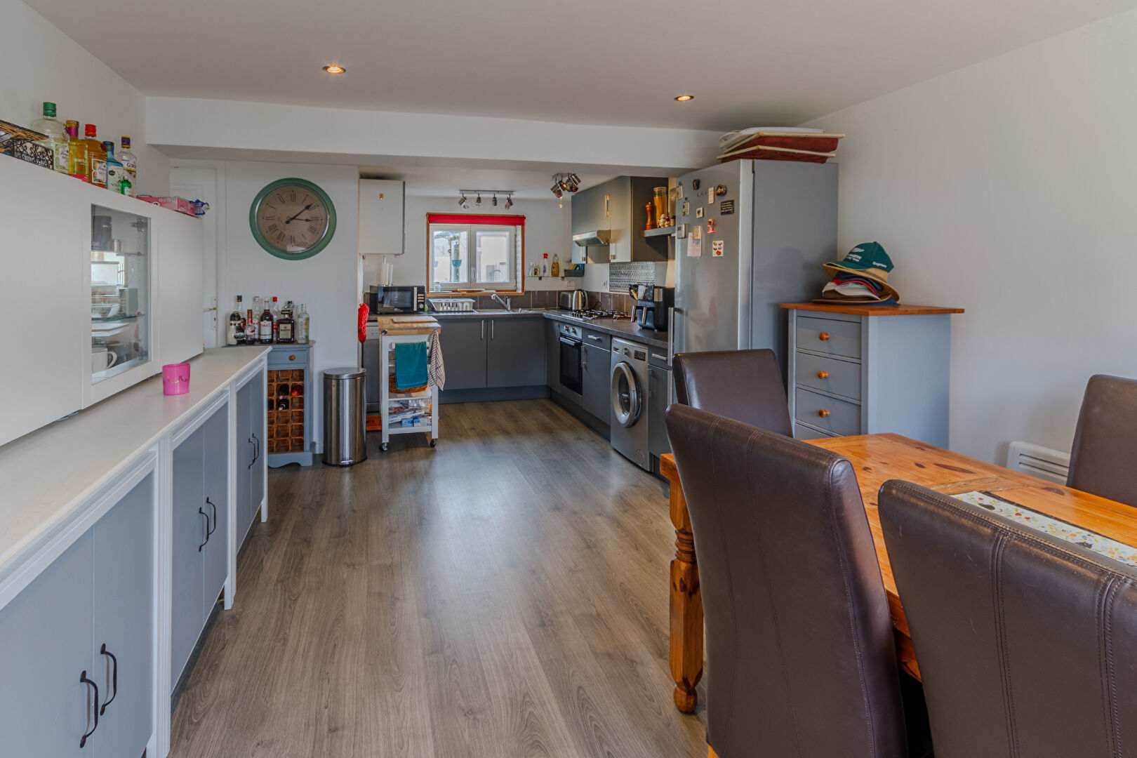 Spacious kitchen and dining area in a property located in Manche, Normandy, featuring modern appliances and ample storage.