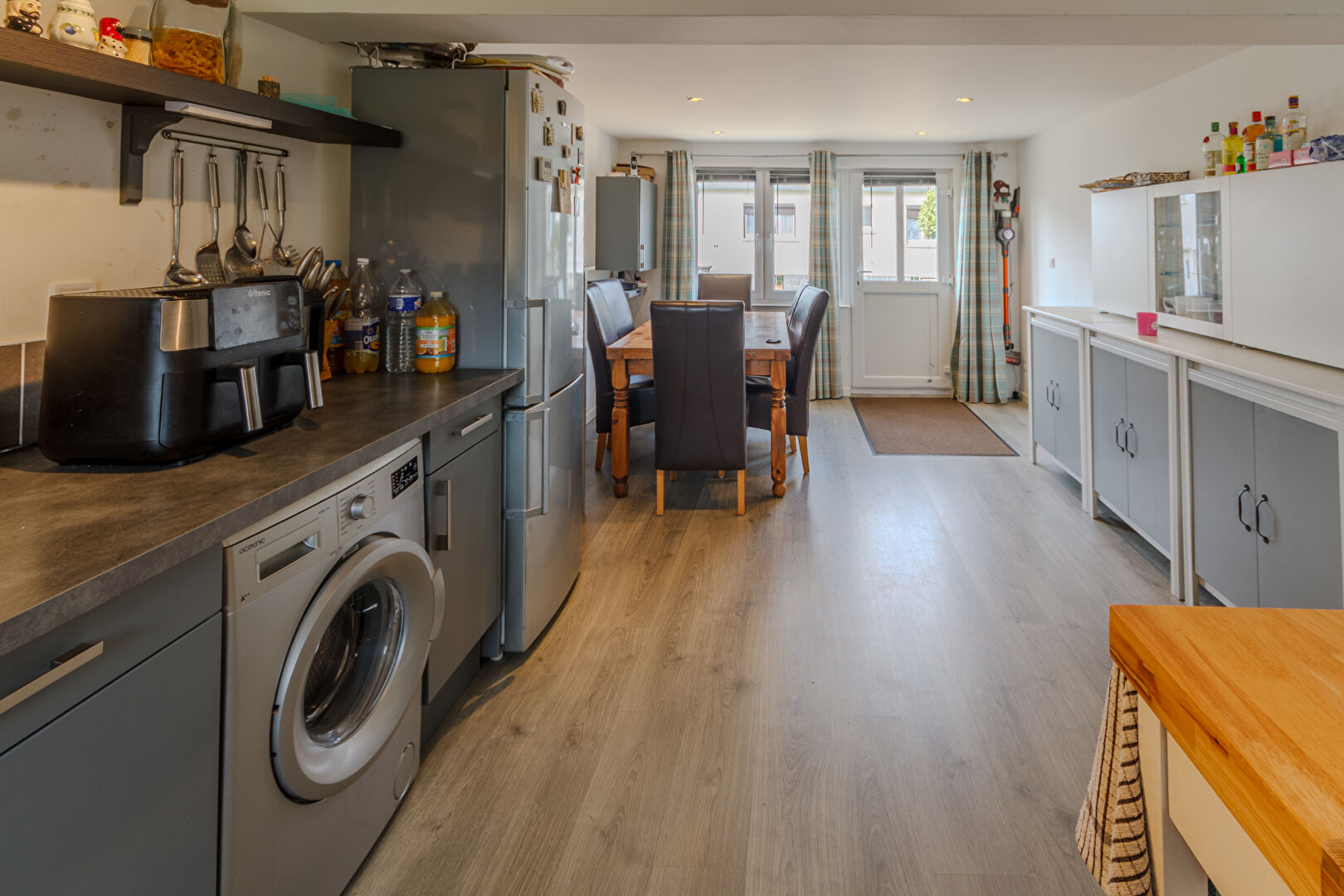 Spacious property in Manche, Normandy, featuring a modern kitchen and dining area with three bedrooms.