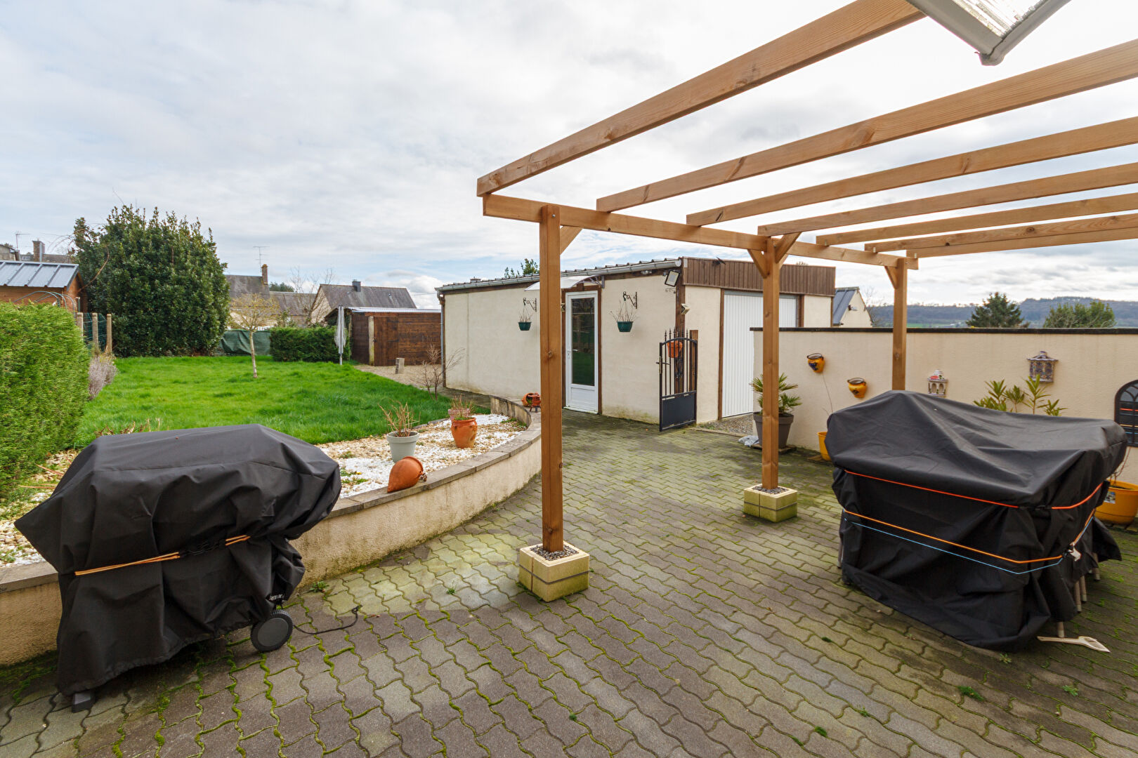 Spacious outdoor area with barbecues, located in Manche, Normandy, perfect for gatherings at the property.