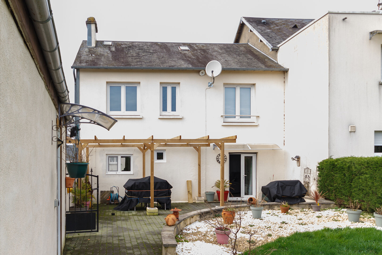 Three-bedroom property in Manche, Normandy, featuring a garden, terrace, and outdoor seating area.