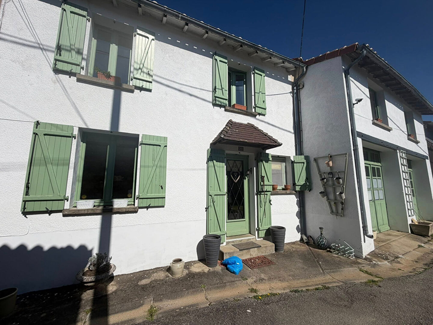 Charming property in Haute-Vienne, Nouvelle-Aquitaine, featuring green shutters and a welcoming entrance.