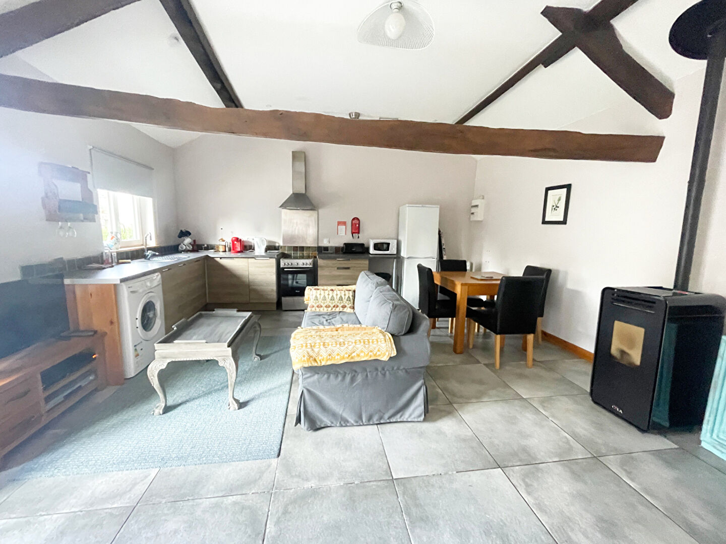 Spacious property in Finistère, Brittany, featuring a modern kitchen, living area, and dining space.