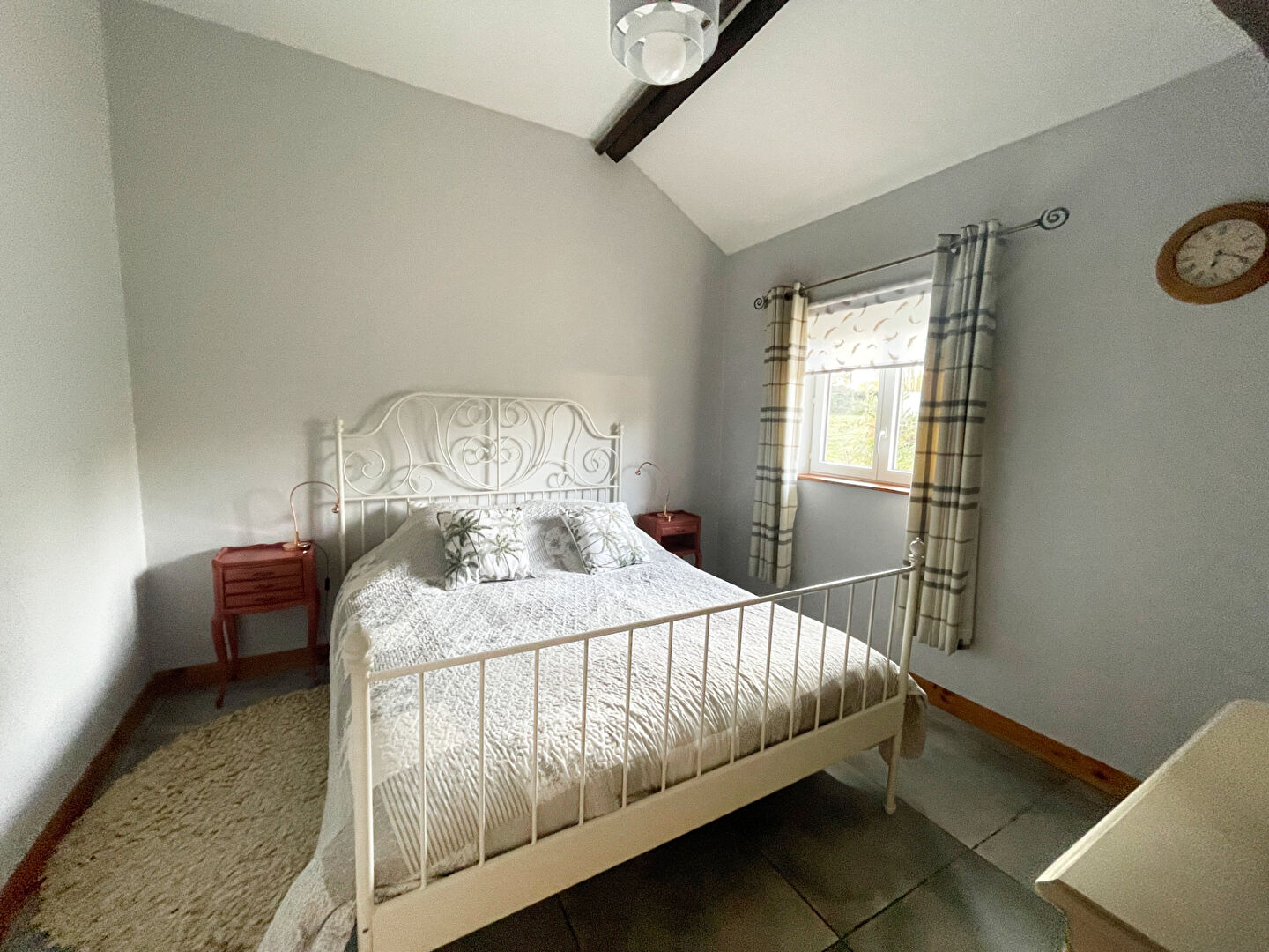 4-bedroom property in Finistère, Brittany, featuring a bright bedroom with a double bed and elegant decor.