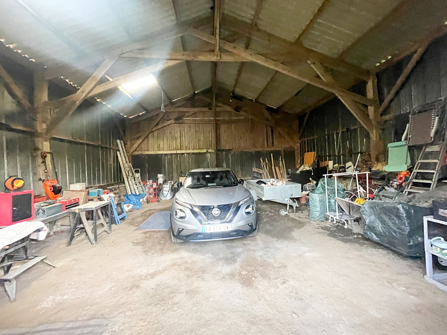 Spacious property in Finistère, Brittany, featuring a large barn with ample storage and workspace.