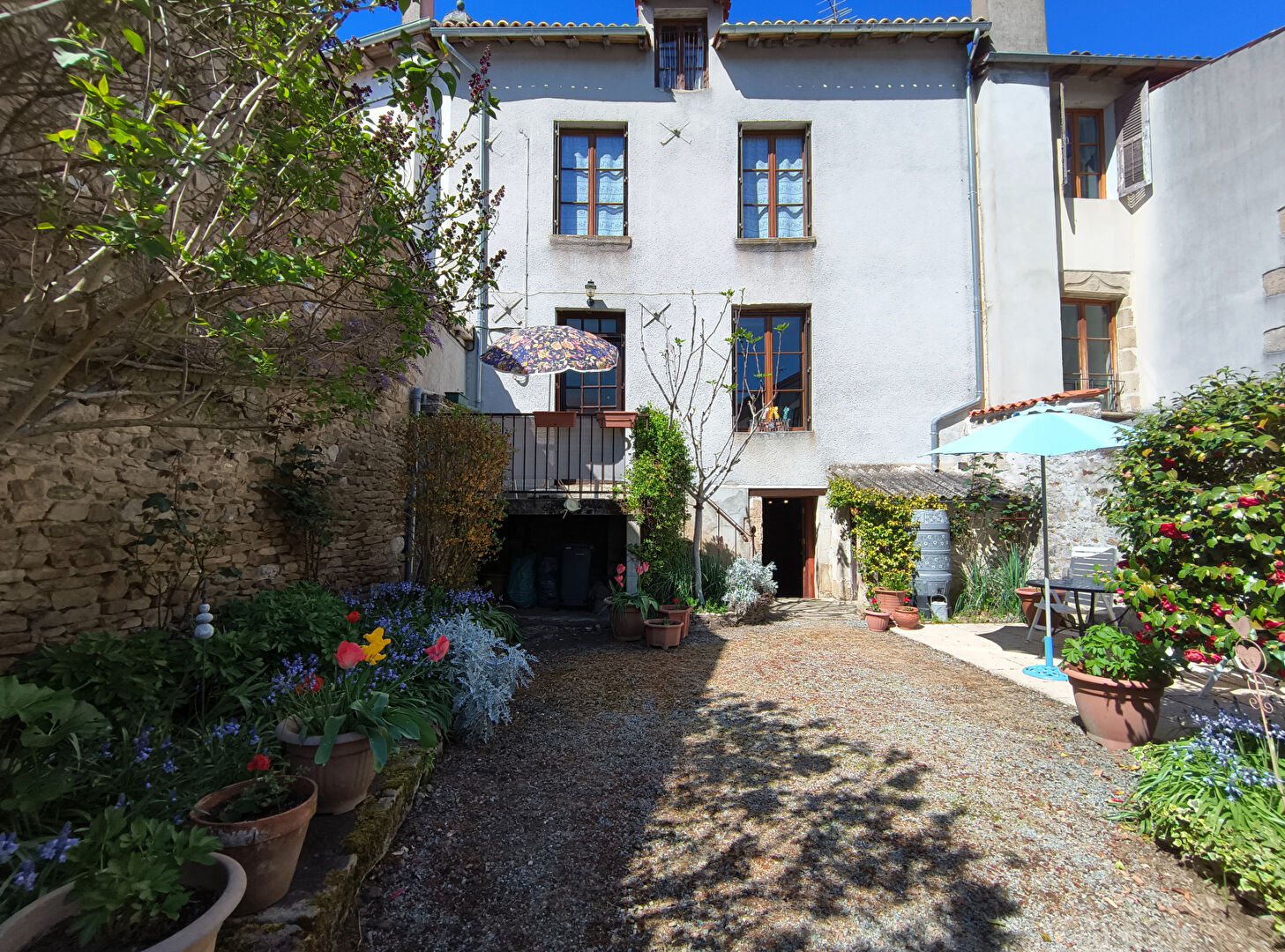 Charming property in Haute-Vienne featuring a landscaped garden and outdoor seating area.