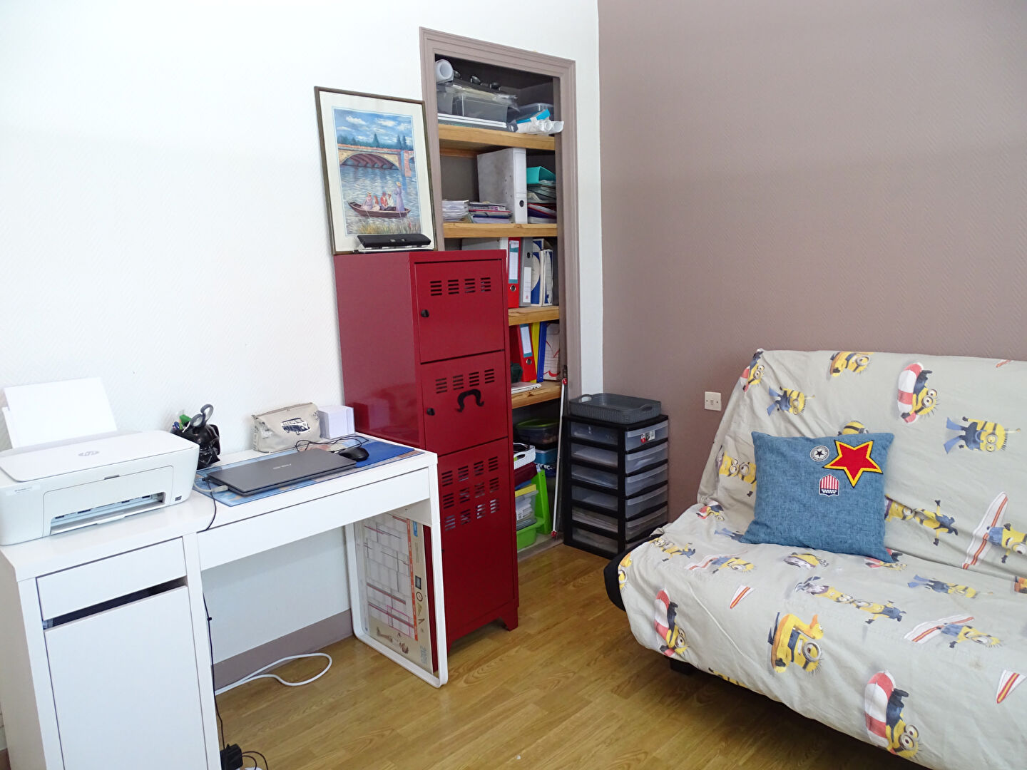 Property in Finistère, Brittany, featuring a small office area and a sofa bed in a cosy interior space.
