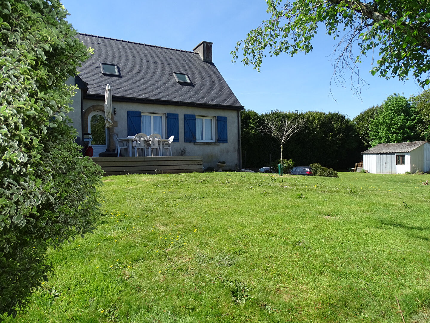 Four-bedroom property in Finistère, Brittany, featuring a garden, terrace, and surrounding greenery.