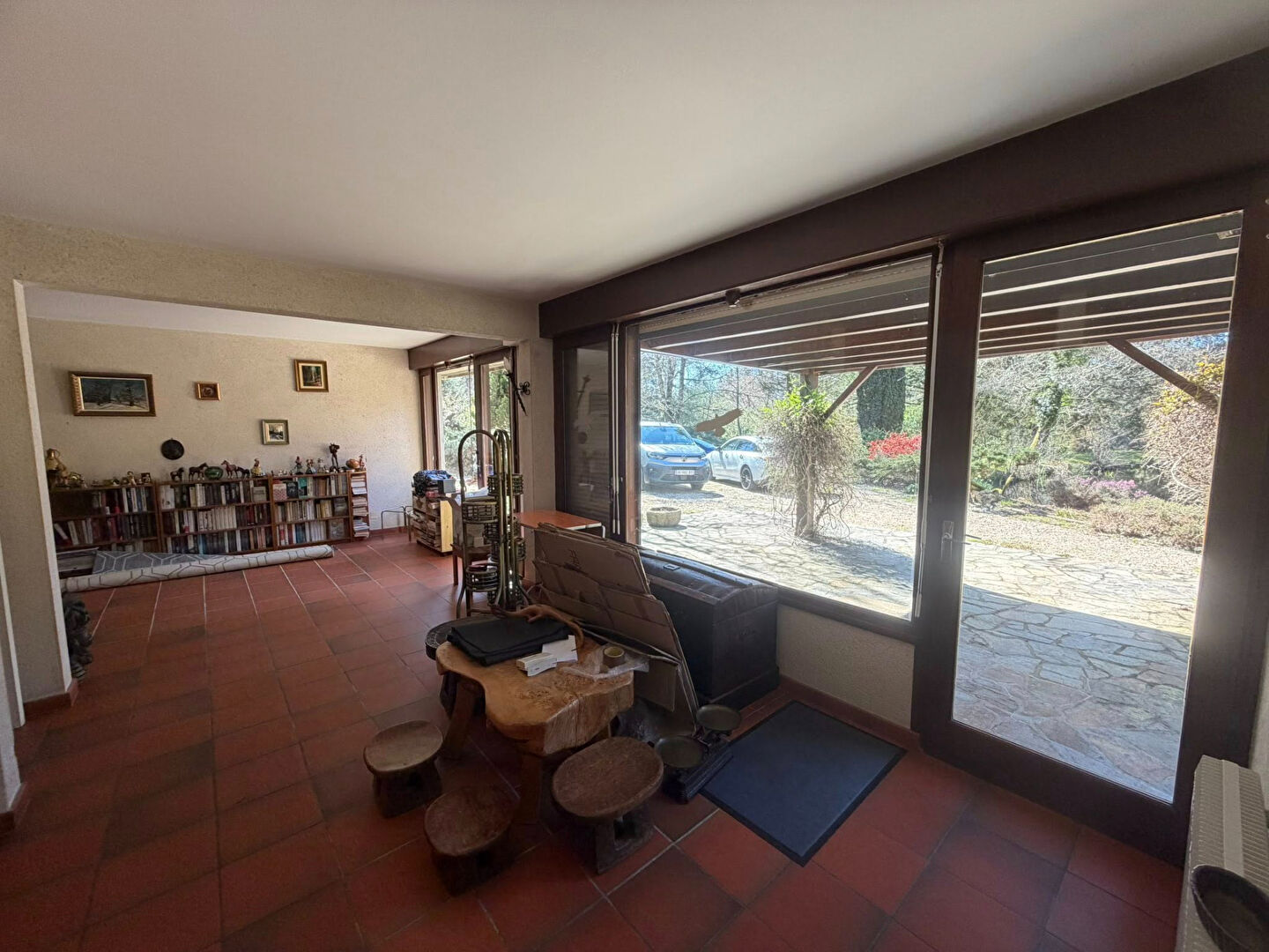 Spacious interior of a property in Haute-Vienne, Nouvelle-Aquitaine, featuring natural light and garden views.