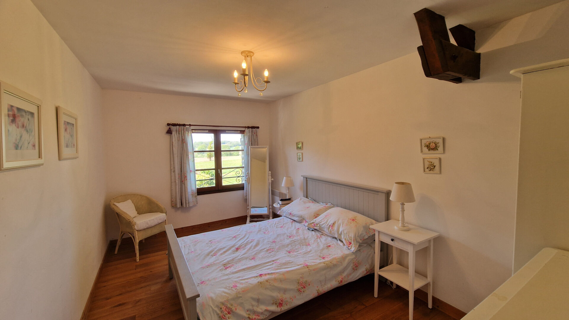 Four-bedroom property in Morbihan, Brittany, featuring wooden flooring and natural light in a spacious room.