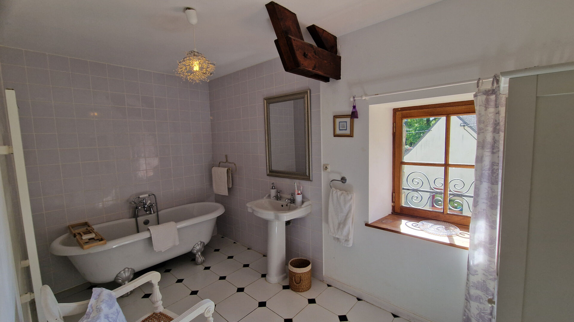 Spacious property in Morbihan, Brittany, featuring landscaped garden with seating area and scenic views.