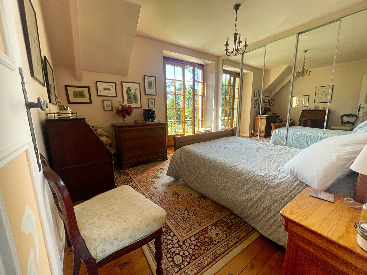 Six-bedroom property in Finistère, Brittany, featuring wooden floors and large windows with garden views.