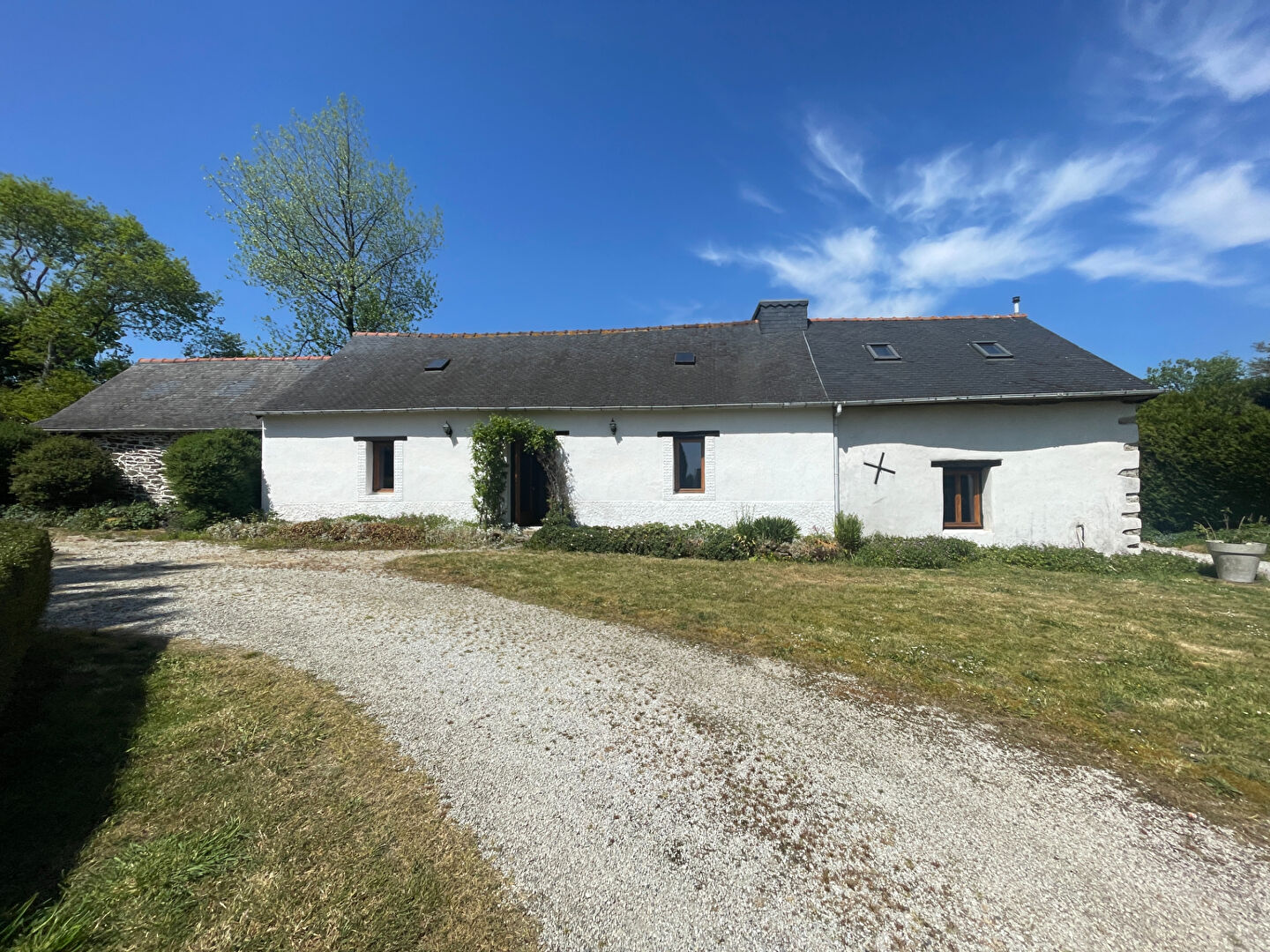 Spacious living area with stone feature wall in a property located in Finistère, Brittany, featuring six bedrooms.