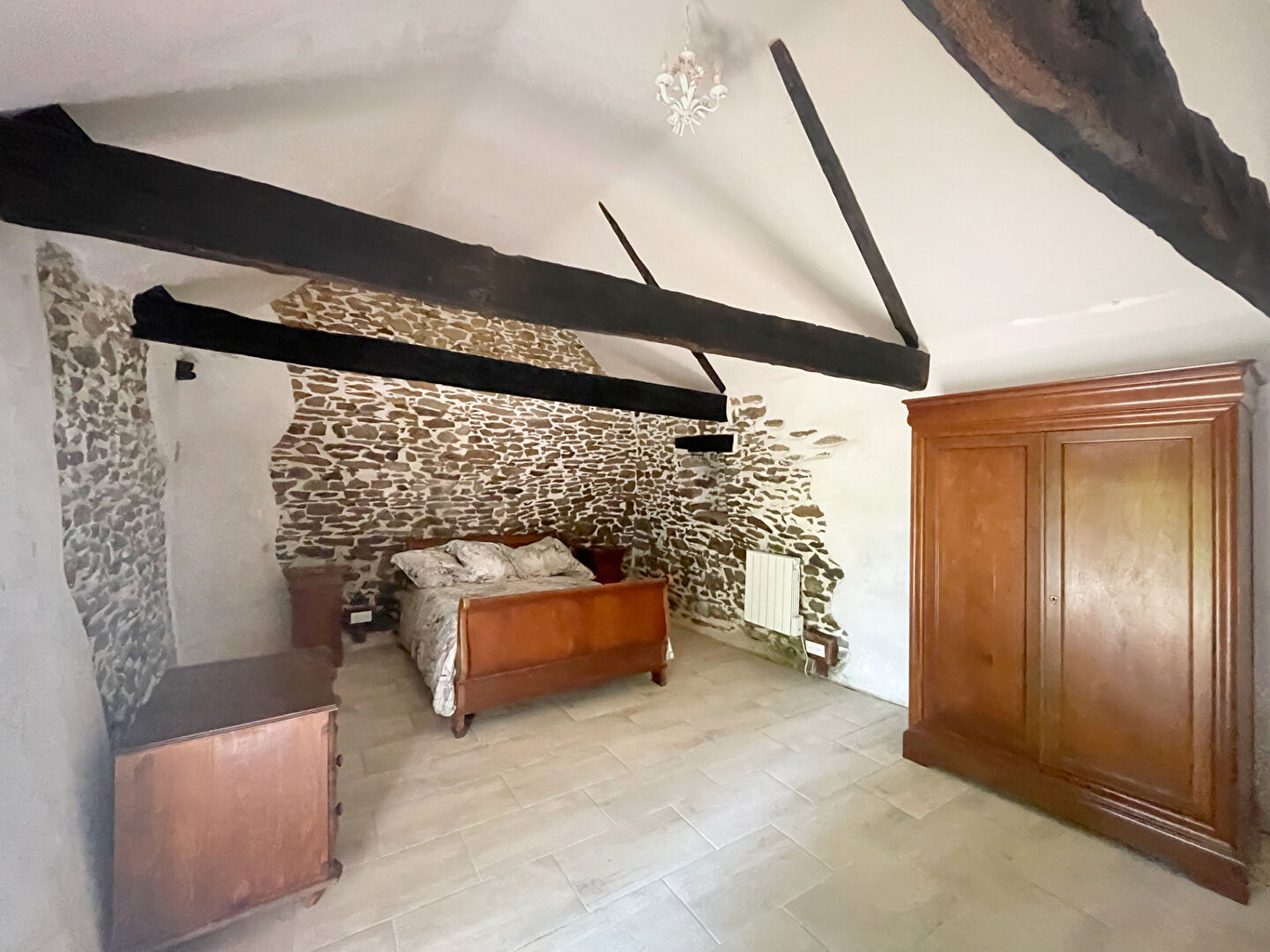 Stone property in Finistère, Brittany, featuring a landscaped garden and tranquil rural surroundings.