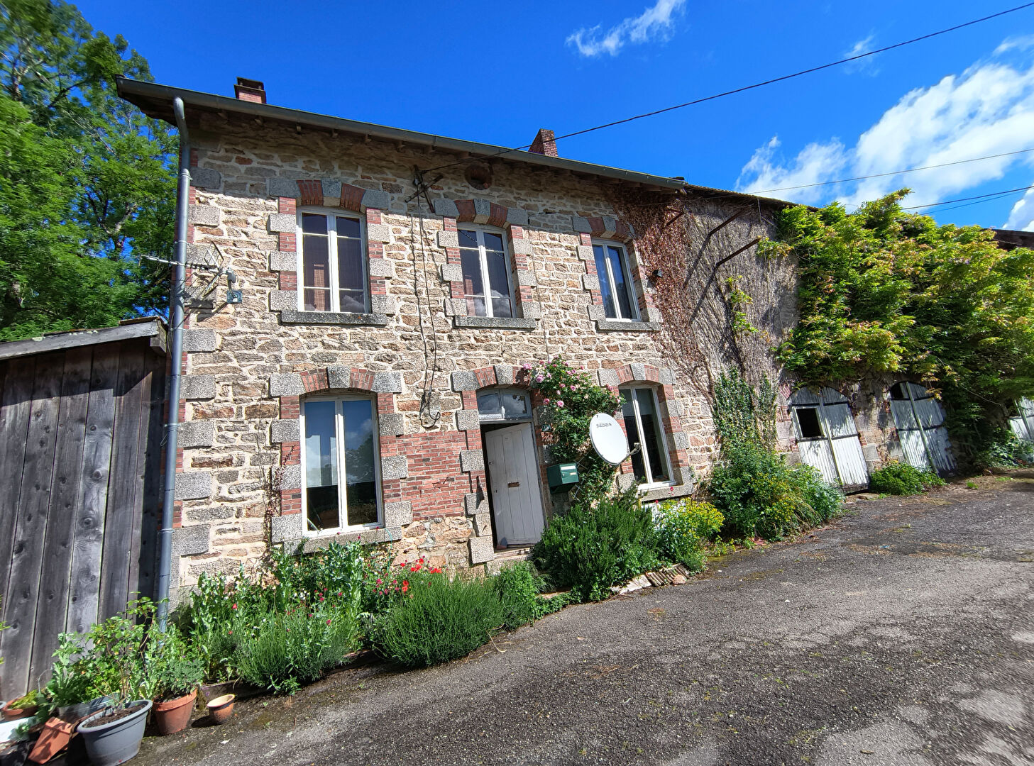 Charming property in Creuse, Nouvelle-Aquitaine, featuring stone architecture and landscaped garden.