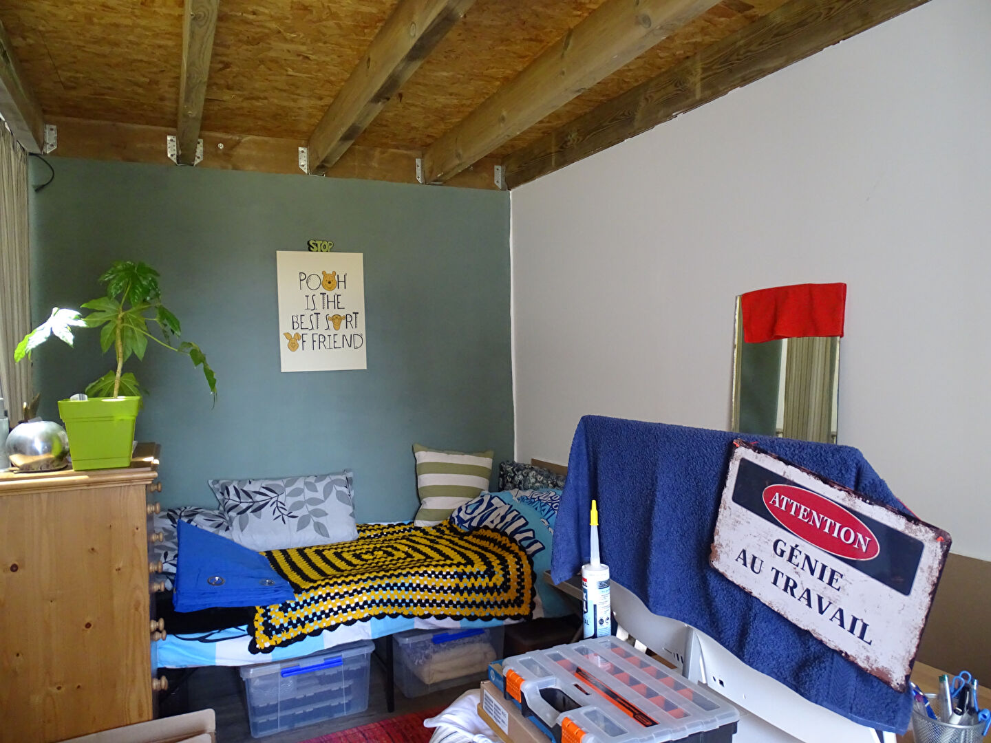 Two-bedroom property in Finistère, Brittany, featuring a cosy interior with a bed, decorative elements, and storage options.