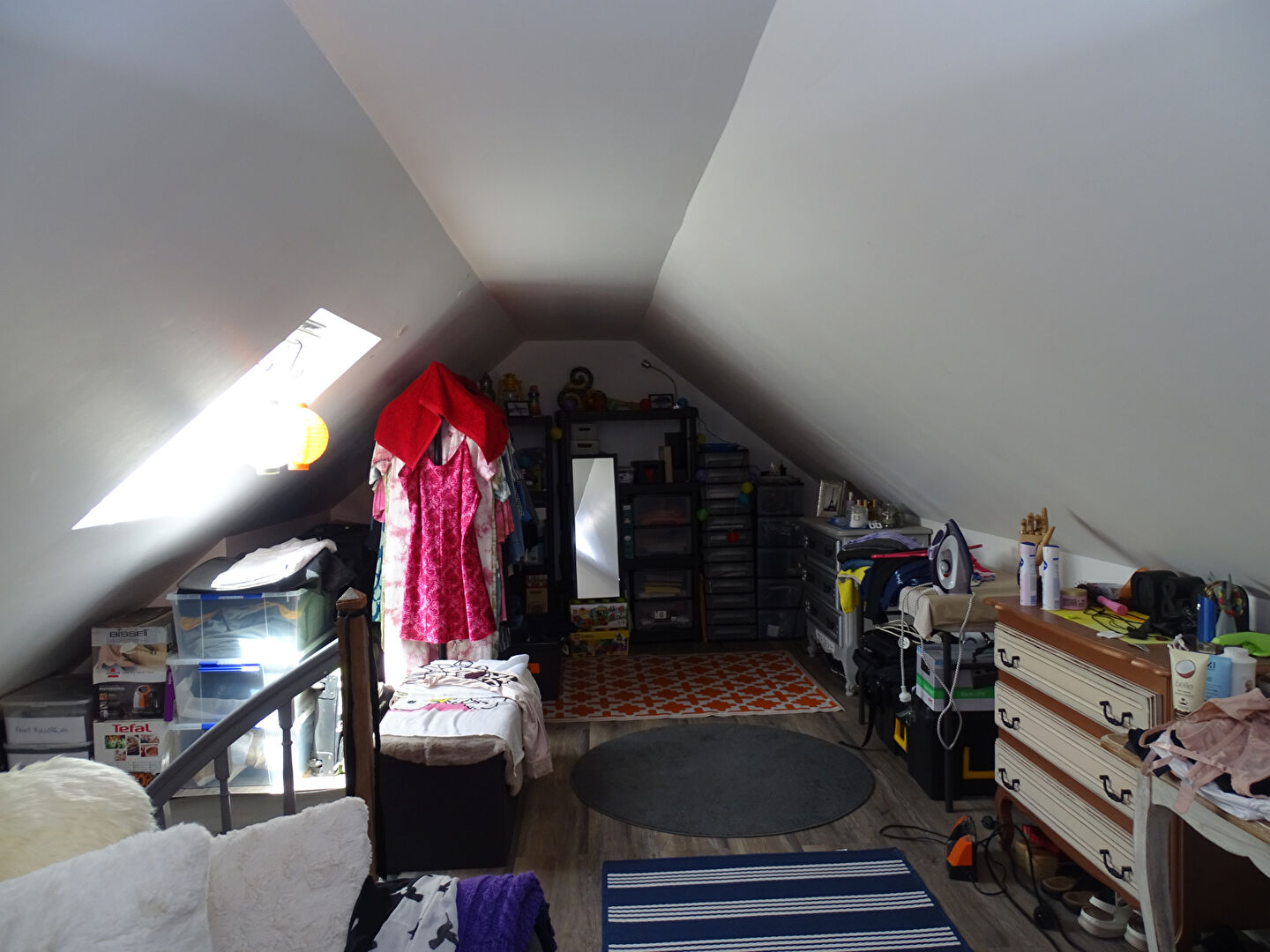 Attic room featuring storage, natural light, and potential for renovation in Finistère, Brittany, 29530, France.