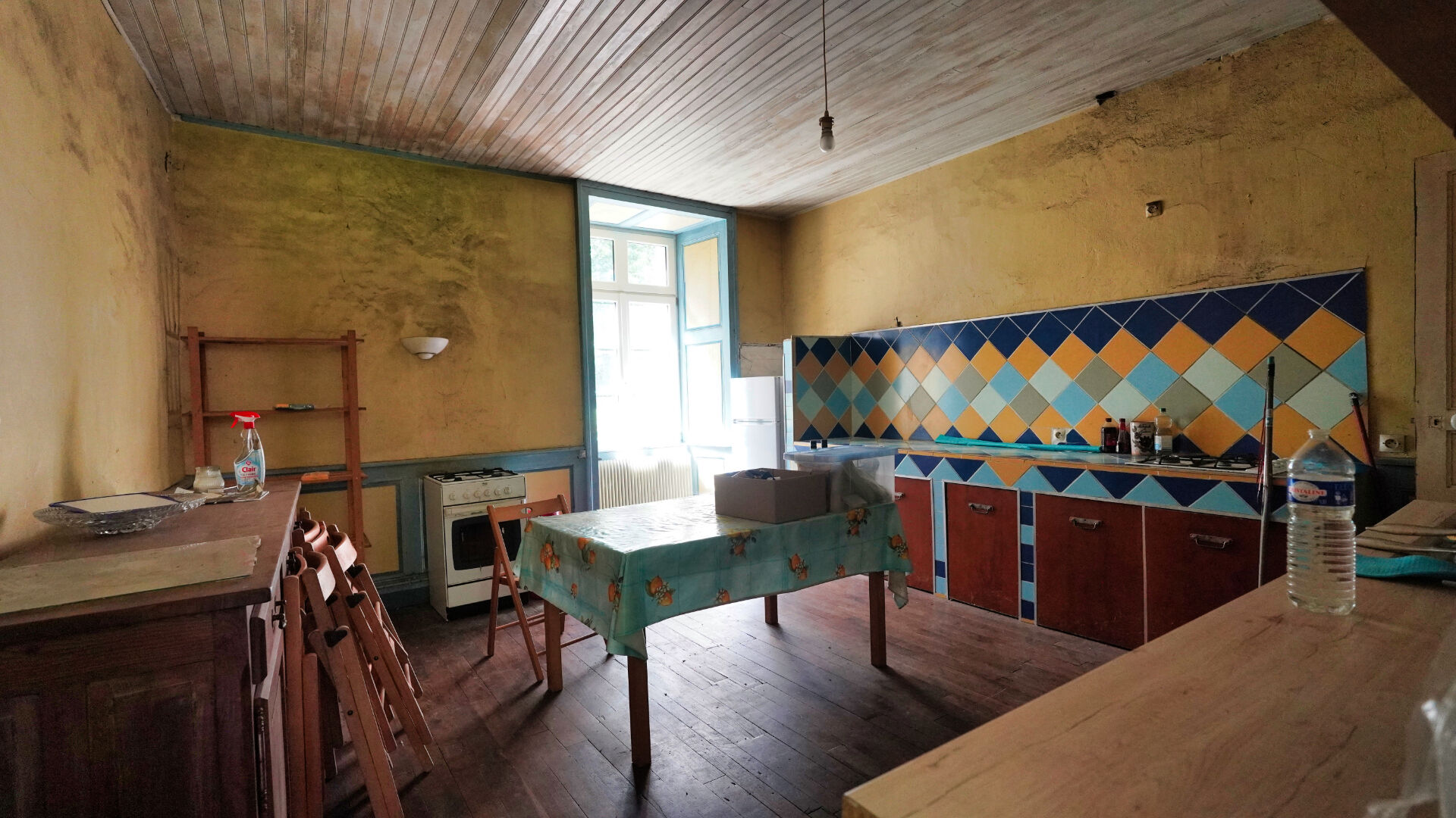 Spacious kitchen in a property, featuring colourful tiles, in Morbihan, Brittany, 56200.