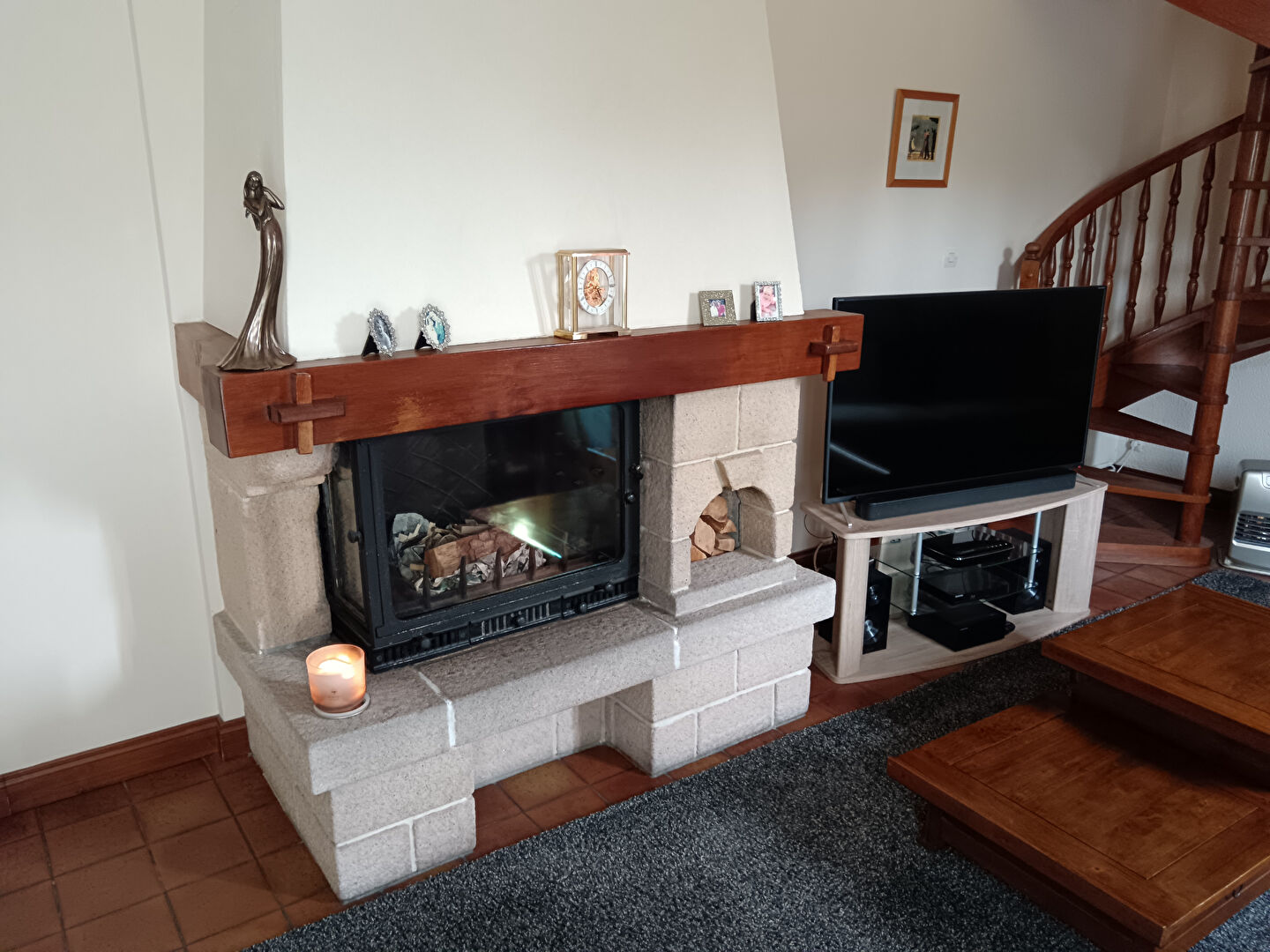 Modern property in Manche, Normandy, featuring a stylish fireplace and inviting living room atmosphere.