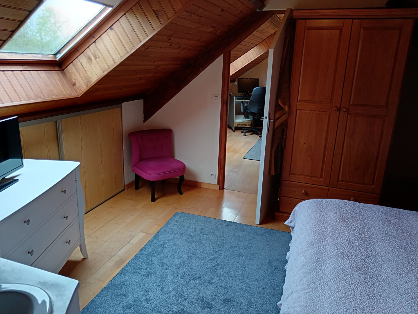 Spacious room with wooden beams, skylight, and storage, located in Manche, Normandy, featuring 5 bedrooms.