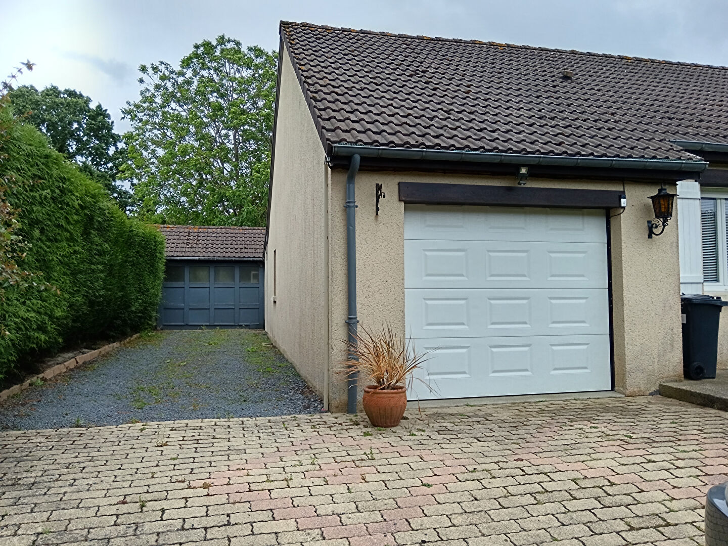 Five-bedroom property with garage and driveway in Manche, Normandy, featuring landscaped outdoor space.